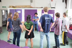 Image of group standing in circle