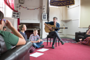 Image of guitar tutor teaching session
