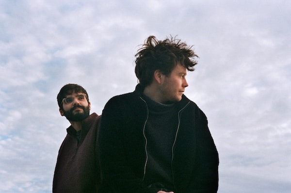 Publicity photo of duo Spafford Campbell against the sky