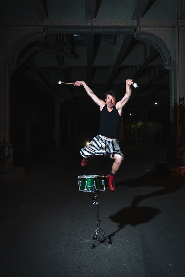 Sean Noonan leaping over a snare drum