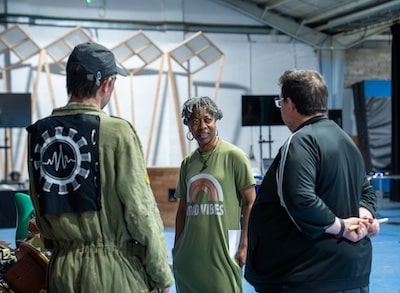 Three people talking together at 101 Outdoor Arts