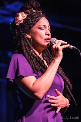 Angeline Morrison singing with microphone